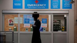 A member of the Hasidic Jewish community walks outside the emergency centre at Maimonides Medical Center during the outbreak of the coronavirus disease in the Brooklyn borough of New York.(Reuters Photo) A member of the Hasidic Jewish community walks outside the emergency centre at Maimonides Medical Center during the outbreak of the coronavirus disease in the Brooklyn borough of New York.(Reuters Photo)