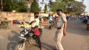 A police personnel hits a person out breaking restrictions at Danapur during lockdown against coronavirus in Patna, Bihar, India on Tuesday April 14, 2020.(Photo: Santosh Kumar / Hindustan Times) A police personnel hits a person out breaking restrictions at Danapur during lockdown against coronavirus in Patna, Bihar, India on Tuesday April 14, 2020.(Photo: Santosh Kumar / Hindustan Times)