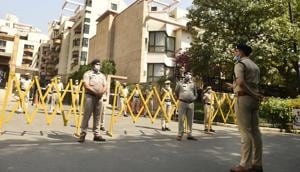 ACP Karan Goel gives instructions to a police team deployed outside the Laburnum Condominium containment area at Sushant Lok-1 near IFFCO Chowk metro station, on day seventeen of the 21-day nationwide lockdown to check the spread of coronavirus, in Gurugram, India, on Friday, April 10, 2020.(Parveen Kumar/Hindustan Times) ACP Karan Goel gives instructions to a police team deployed outside the Laburnum Condominium containment area at Sushant Lok-1 near IFFCO Chowk metro station, on day seventeen of the 21-day nationwide lockdown to check the spread of coronavirus, in Gurugram, India, on Friday, April 10, 2020.(Parveen Kumar/Hindustan Times)