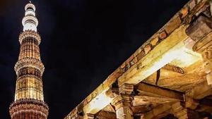 A view of the illuminated Qutub Minar, which is a 73m-high and five-storey tower of victory, built in 1193 by Qutab-ud-din Aibak. The first three storeys are made of red sandstone, the fourth and fifth storeys are of marble and sandstone. At the foot of the tower is the Quwwat-ul-Islam Mosque, which is said to be the first mosque built in India.