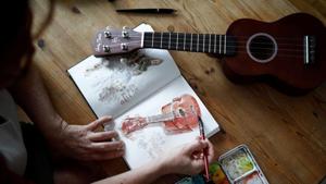 Agnes Goyet, a Parisian artist who documented life in lockdown in a journal during the coronavirus disease (COVID-19) outbreak, paints on paper with watercolours in her apartment in Paris, France.(REUTERS) Agnes Goyet, a Parisian artist who documented life in lockdown in a journal during the coronavirus disease (COVID-19) outbreak, paints on paper with watercolours in her apartment in Paris, France.(REUTERS)
