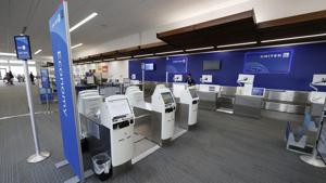 A lone ticketing agent works the United Airlines counter at Colorado Springs Airport on Saturday, in Colorado, on April 18.(AP Photo) A lone ticketing agent works the United Airlines counter at Colorado Springs Airport on Saturday, in Colorado, on April 18.(AP Photo)