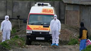 Kashmiri ambulance drivers wearing protective gear stand in front of an ambulance outside a hospital compound in Srinagar.(WASEEM ANDRABI/HT PHOTO.) Kashmiri ambulance drivers wearing protective gear stand in front of an ambulance outside a hospital compound in Srinagar.(WASEEM ANDRABI/HT PHOTO.)