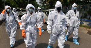 Kolkata Municipal Corporation (KMC) workers and health department staff in Personal Petective Equipment (PPE) suits head to Belgachia Bustee, a coronavirus hotspot to collect data during lockdown in Kolkata, West Bengal, India on April 16, 2020.(Samir Jana / Hindustan Times) Kolkata Municipal Corporation (KMC) workers and health department staff in Personal Petective Equipment (PPE) suits head to Belgachia Bustee, a coronavirus hotspot to collect data during lockdown in Kolkata, West Bengal, India on April 16, 2020.(Samir Jana / Hindustan Times)
