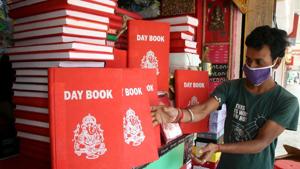 A shopkeeper wearing a mask waits for customers in Agartala on Monday.(ANI Photo) A shopkeeper wearing a mask waits for customers in Agartala on Monday.(ANI Photo)