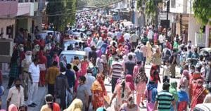 Residents gathered in anticipation of free ration in Mauli Jagran, Chandigarh, on Wednesday.(Sant Arora/HT) Residents gathered in anticipation of free ration in Mauli Jagran, Chandigarh, on Wednesday.(Sant Arora/HT)