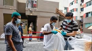 Food distribution takes place at Westlite Toh Guan dormitory, as the outbreak of the coronavirus disease (COVID-19) continues, in Singapore April 7, 2020.(REUTERS)