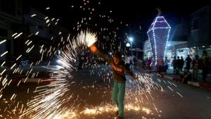 A Palestinian boy waves a homemade sparkler firework as he celebrates ahead of the holy fasting month, amid concerns about the spread of the coronavirus disease (COVID-19), in the southern Gaza Strip.(REUTERS) A Palestinian boy waves a homemade sparkler firework as he celebrates ahead of the holy fasting month, amid concerns about the spread of the coronavirus disease (COVID-19), in the southern Gaza Strip.(REUTERS)