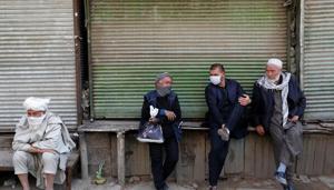 Afghan men sit in front of closed shops during the coronavirus disease (Covid-19) outbreak in Kabul, Afghanistan April 23, 2020.(REUTERS) Afghan men sit in front of closed shops during the coronavirus disease (Covid-19) outbreak in Kabul, Afghanistan April 23, 2020.(REUTERS)