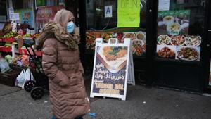 A woman walks through a neighbourhood with numerous halal restaurants and groceries on the eve of the Muslim Ramadan holiday on April 23, 2020 in New York City.(AFP) A woman walks through a neighbourhood with numerous halal restaurants and groceries on the eve of the Muslim Ramadan holiday on April 23, 2020 in New York City.(AFP)