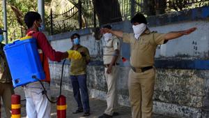 A security guard being sanitized outside the Poddar hospital, Worli, Mumbai, during the lockdown to curb the spread of coronavirus, Thursday, April 23, 2020.(Satish Bate/HT Photo) A security guard being sanitized outside the Poddar hospital, Worli, Mumbai, during the lockdown to curb the spread of coronavirus, Thursday, April 23, 2020.(Satish Bate/HT Photo)