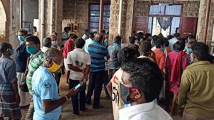People gather outside the office of District Collector to get the E-pass for vehicles during the nationwide Covid-19 lockdown in Madurai on Friday. (ANI Photo)(ANI) People gather outside the office of District Collector to get the E-pass for vehicles during the nationwide Covid-19 lockdown in Madurai on Friday. (ANI Photo)(ANI)