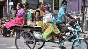 Women travel by a rickshaw as they return after buying daily essentials during the coronavirus lockdown in Vijayawada on Saturday. (ANI Photo)(ANI) Women travel by a rickshaw as they return after buying daily essentials during the coronavirus lockdown in Vijayawada on Saturday. (ANI Photo)(ANI)