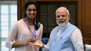 Prime Minister Narendra Modi congratulates World Badminton champion PV Sindhu during a meeting in New Delhi.(ANI Photo) Prime Minister Narendra Modi congratulates World Badminton champion PV Sindhu during a meeting in New Delhi.(ANI Photo)