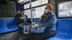 A nurse (right) attempts to reason with a fellow bus passenger who refuses to wear a face mask in the wake of Covid-19 pandemic, in upper Manhattan, New York.(AP Photo) A nurse (right) attempts to reason with a fellow bus passenger who refuses to wear a face mask in the wake of Covid-19 pandemic, in upper Manhattan, New York.(AP Photo)