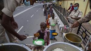 Homeless people line up for free food distributed by Police during lockdown to curb the spread of new coronavirus, in Gauhati, India.(AP/ Representative image) Homeless people line up for free food distributed by Police during lockdown to curb the spread of new coronavirus, in Gauhati, India.(AP/ Representative image)