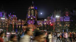 Pedestrians walk past the Chhatrapati Shivaji Terminus railway station illuminated at night in Mumbai, India.(Bloomberg/ File photo) Pedestrians walk past the Chhatrapati Shivaji Terminus railway station illuminated at night in Mumbai, India.(Bloomberg/ File photo)