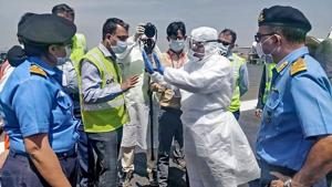 Medical team members from the Navy, wearing protective gear, brief airport officials before the evacuation of Indian nationals from Iran and their arrival in India, at Chhatrapati Shivaji International Airport in Mumbai on March 13, 2020.(AFP) Medical team members from the Navy, wearing protective gear, brief airport officials before the evacuation of Indian nationals from Iran and their arrival in India, at Chhatrapati Shivaji International Airport in Mumbai on March 13, 2020.(AFP)