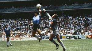 Argentina's Diego Maradona scores 1st goal with his Hand of God, past England goalkeeper Peter Shilton.(Bob Thomas/Getty Images) Argentina's Diego Maradona scores 1st goal with his Hand of God, past England goalkeeper Peter Shilton.(Bob Thomas/Getty Images)