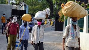 Migrant labourers stand in a queue for thermal screening as they arrive from Madhya Pradesh via Buses during the nationwide Covid-19 lockdown in Prayagraj on Thursday.(ANI) Migrant labourers stand in a queue for thermal screening as they arrive from Madhya Pradesh via Buses during the nationwide Covid-19 lockdown in Prayagraj on Thursday.(ANI)