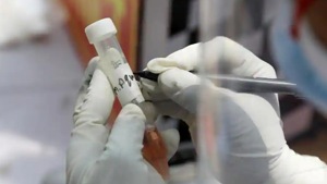 A medical worker wearing protective gloves signs a swab sample vial at a mobile testing center, during an extended nationwide lockdown to slow the spread of the coronavirus disease.(Reuters photo) A medical worker wearing protective gloves signs a swab sample vial at a mobile testing center, during an extended nationwide lockdown to slow the spread of the coronavirus disease.(Reuters photo)