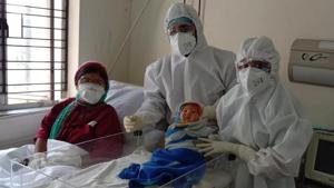 The mother and the child were kept in the same room, to help build the bond, but at a distance of six feet to prevent any infection from spreading to the child. At the time of breastfeeding, the nursing mother wore masks, sunglasses, gloves and her whole body was sanitized.(HT PHOTO.) The mother and the child were kept in the same room, to help build the bond, but at a distance of six feet to prevent any infection from spreading to the child. At the time of breastfeeding, the nursing mother wore masks, sunglasses, gloves and her whole body was sanitized.(HT PHOTO.)