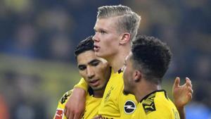 Dortmund's scorer Erling Haaland, center, celebrates his goal with teammates Jadon Sancho, right, and Achraf Hakimi, left, during the German Bundesliga soccer match between Borussia Dortmund and Eintracht Frankfurt.(AP) Dortmund's scorer Erling Haaland, center, celebrates his goal with teammates Jadon Sancho, right, and Achraf Hakimi, left, during the German Bundesliga soccer match between Borussia Dortmund and Eintracht Frankfurt.(AP)