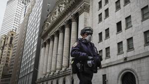 An NYPD officer was caught violently putting a man to the ground and pointing a gun at him for alleged social distancing violation. The officer has been stripped of his gun and badge.(AP) An NYPD officer was caught violently putting a man to the ground and pointing a gun at him for alleged social distancing violation. The officer has been stripped of his gun and badge.(AP)