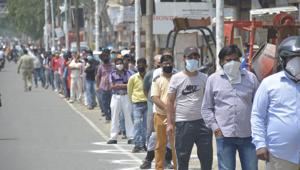 Ghaziabad, India - May 05, 2020: A long queue of people outside a liquor shop after relaxations allowed their opening, at Meerut road, in Ghaziabad, India, on Tuesday, May 05, 2020. (Photo by )(Sakib Ali /Hindustan Times) Ghaziabad, India - May 05, 2020: A long queue of people outside a liquor shop after relaxations allowed their opening, at Meerut road, in Ghaziabad, India, on Tuesday, May 05, 2020. (Photo by )(Sakib Ali /Hindustan Times)