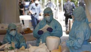 Health workers get ready at a COVID-19 testing center in New Delhi, India, Monday, April 27, 2020.(AP) Health workers get ready at a COVID-19 testing center in New Delhi, India, Monday, April 27, 2020.(AP)