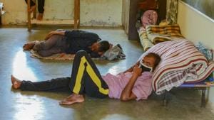 Stranded migrant workers seen at a shelter home affiliated PMC during lockdown in Pune.(Milind Saurkar/HT Photo) Stranded migrant workers seen at a shelter home affiliated PMC during lockdown in Pune.(Milind Saurkar/HT Photo)