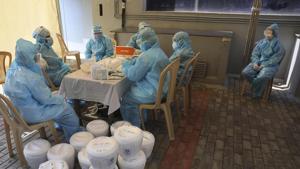 Indian health workers organize the samples at a COVID-19 testing center in New Delhi.(AP) Indian health workers organize the samples at a COVID-19 testing center in New Delhi.(AP)
