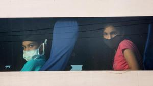 Passengers look out from the window of a bus, after Punjab government subjected them to a mandatory 21-day quarantine in the wake of coronavirus pandemic in Amritsar on April 29, 2020. The passengers were travelling from Nanded in Maharashtra.(PTI File Photo) Passengers look out from the window of a bus, after Punjab government subjected them to a mandatory 21-day quarantine in the wake of coronavirus pandemic in Amritsar on April 29, 2020. The passengers were travelling from Nanded in Maharashtra.(PTI File Photo)
