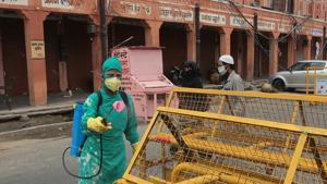 A health worker sanitises a barricade in Ramganj, Jaipur, Rajasthan, Wednesday, May 6, 2020.(Himanshu Vyas / HT Photo) A health worker sanitises a barricade in Ramganj, Jaipur, Rajasthan, Wednesday, May 6, 2020.(Himanshu Vyas / HT Photo)