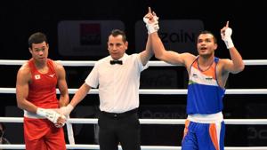 Vkas Krishan (in blue) after a victory Vkas Krishan (in blue) after a victory