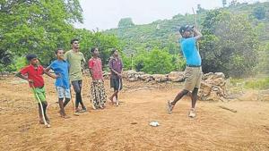 C Muniyappa is watched by, among others, his two sons and a daughter as he goes for a shot and (above) one of the two par-3 holes the Indian Open champ has meticulously built.(HT Photo) C Muniyappa is watched by, among others, his two sons and a daughter as he goes for a shot and (above) one of the two par-3 holes the Indian Open champ has meticulously built.(HT Photo)