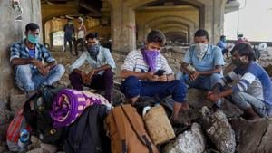 Migrants from Uttar Pradesh and Bihar take rest before they start walking back to their home states, Navi Mumbai, May 10, 2020(PTI) Migrants from Uttar Pradesh and Bihar take rest before they start walking back to their home states, Navi Mumbai, May 10, 2020(PTI)