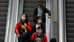 Passengers wearing protective masks travel on an escalator at an airport terminal following an outbreak of the coronavirus disease (COVID-19), in New Delhi, India, March 14, 2020. REUTERS/Anushree Fadnavis(REUTERS) Passengers wearing protective masks travel on an escalator at an airport terminal following an outbreak of the coronavirus disease (COVID-19), in New Delhi, India, March 14, 2020. REUTERS/Anushree Fadnavis(REUTERS)