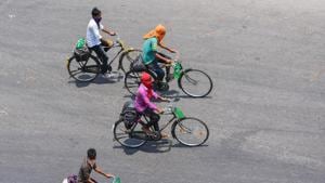 Migrants riding bicycles from Chennai on their way to their native places in Odisha pass through Vijayawada,.(PTI) Migrants riding bicycles from Chennai on their way to their native places in Odisha pass through Vijayawada,.(PTI)