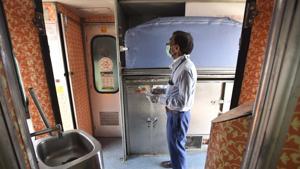 A railway worker cleans coaches as the Indian Railways prepare to partially resume passenger services from tomorrow at the New Delhi Railway Station (NDLS) Coach Care Center, in Ajmeri Gate, New Delhi.(Sonu Mehta/HT PHOTO) A railway worker cleans coaches as the Indian Railways prepare to partially resume passenger services from tomorrow at the New Delhi Railway Station (NDLS) Coach Care Center, in Ajmeri Gate, New Delhi.(Sonu Mehta/HT PHOTO)