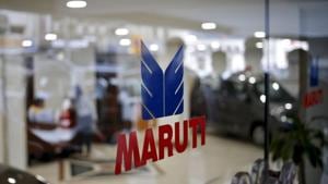 The logo of Maruti Suzuki India Limited is seen on a glass door at a showroom in New Delhi, India.(REUTERS) The logo of Maruti Suzuki India Limited is seen on a glass door at a showroom in New Delhi, India.(REUTERS)