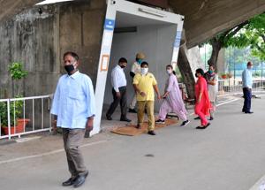 Punjab University employees coming out from the administrative block on Wednesday.(RAVI KUMAR/HT) Punjab University employees coming out from the administrative block on Wednesday.(RAVI KUMAR/HT)