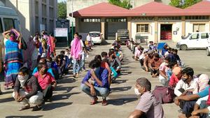 Migrants waiting in lines for a medical check-up at Phagwara civil hospital on Friday. Migrants waiting in lines for a medical check-up at Phagwara civil hospital on Friday.