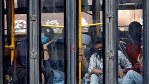 Migrant workers look out from a bus as they wait to enter a railway station to board a train to reach their home state of Uttarakhand, after a limited reopening of India’s giant rail network following a nearly seven-week lockdown to slow the spreading of the coronavirus disease.(REUTERS) Migrant workers look out from a bus as they wait to enter a railway station to board a train to reach their home state of Uttarakhand, after a limited reopening of India’s giant rail network following a nearly seven-week lockdown to slow the spreading of the coronavirus disease.(REUTERS)