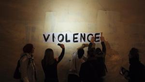 In this Oct. 31, 2019 photo, the word "violence" is pasted onto a wall by a group of women in a dark street in Paris. In Paris and cities across France, the signs are everywhere. "Complaints ignored, women killed" and "She leaves him, he kills her," they read in black block letters pasted over stately municipal buildings. Under cover of night, activists have glued them to the walls to draw attention to domestic violence, a problem French President Emmanuel Macron has called "France's shame." (AP Photo/Kamil Zihnioglu)(AP) In this Oct. 31, 2019 photo, the word "violence" is pasted onto a wall by a group of women in a dark street in Paris. In Paris and cities across France, the signs are everywhere. "Complaints ignored, women killed" and "She leaves him, he kills her," they read in black block letters pasted over stately municipal buildings. Under cover of night, activists have glued them to the walls to draw attention to domestic violence, a problem French President Emmanuel Macron has called "France's shame." (AP Photo/Kamil Zihnioglu)(AP)