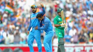 Kedar Jadhav of India celebrates the wicket of Babar Azam of Pakistan with Virat Kohli during the ICC Champions trophy cricket match between India and Pakistan at The Oval in London on June 18, 2017 (Photo by Clive Rose/Getty Images)(Getty Images) Kedar Jadhav of India celebrates the wicket of Babar Azam of Pakistan with Virat Kohli during the ICC Champions trophy cricket match between India and Pakistan at The Oval in London on June 18, 2017 (Photo by Clive Rose/Getty Images)(Getty Images)