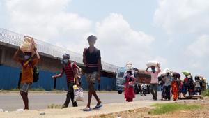 Migrants workers walk along the national highway for their native places, during the nationwide lockdown, in Bhubaneswar on May 12.(ANI Photo) Migrants workers walk along the national highway for their native places, during the nationwide lockdown, in Bhubaneswar on May 12.(ANI Photo)