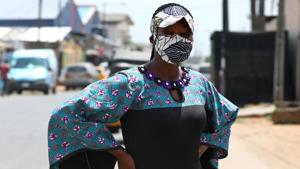 Nigerian fashion stylist, Angela Innocent, 38, poses for a picture with a fabric face mask matching her hat, following the spread of the coronavirus disease (COVID-19) in Lagos, Nigeria May 13, 2020. Picture taken May 13, 2020.(REUTERS)