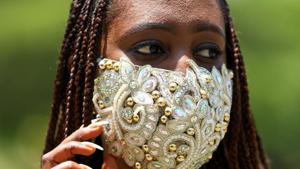 Nigerian fashion stylist Sefiya Diejomoah, 35, poses for a picture with a blinged-out face mask matching with her clothes, following the spread of the coronavirus disease (COVID-19) in Lagos, Nigeria May 14, 2020. Picture taken May 14, 2020. REUTERS/Temilade Adelaja(REUTERS) Nigerian fashion stylist Sefiya Diejomoah, 35, poses for a picture with a blinged-out face mask matching with her clothes, following the spread of the coronavirus disease (COVID-19) in Lagos, Nigeria May 14, 2020. Picture taken May 14, 2020. REUTERS/Temilade Adelaja(REUTERS)
