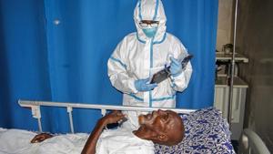 In this photo taken Wednesday, May, 13, 2020, a doctor tends to a patient in a ward for coronavirus patients at the Martini Hospital in Mogadishu, Somalia. Years of conflict, instability and poverty have left Somalia ill-equipped to handle a health crisis like the coronavirus pandemic.(AP) In this photo taken Wednesday, May, 13, 2020, a doctor tends to a patient in a ward for coronavirus patients at the Martini Hospital in Mogadishu, Somalia. Years of conflict, instability and poverty have left Somalia ill-equipped to handle a health crisis like the coronavirus pandemic.(AP)